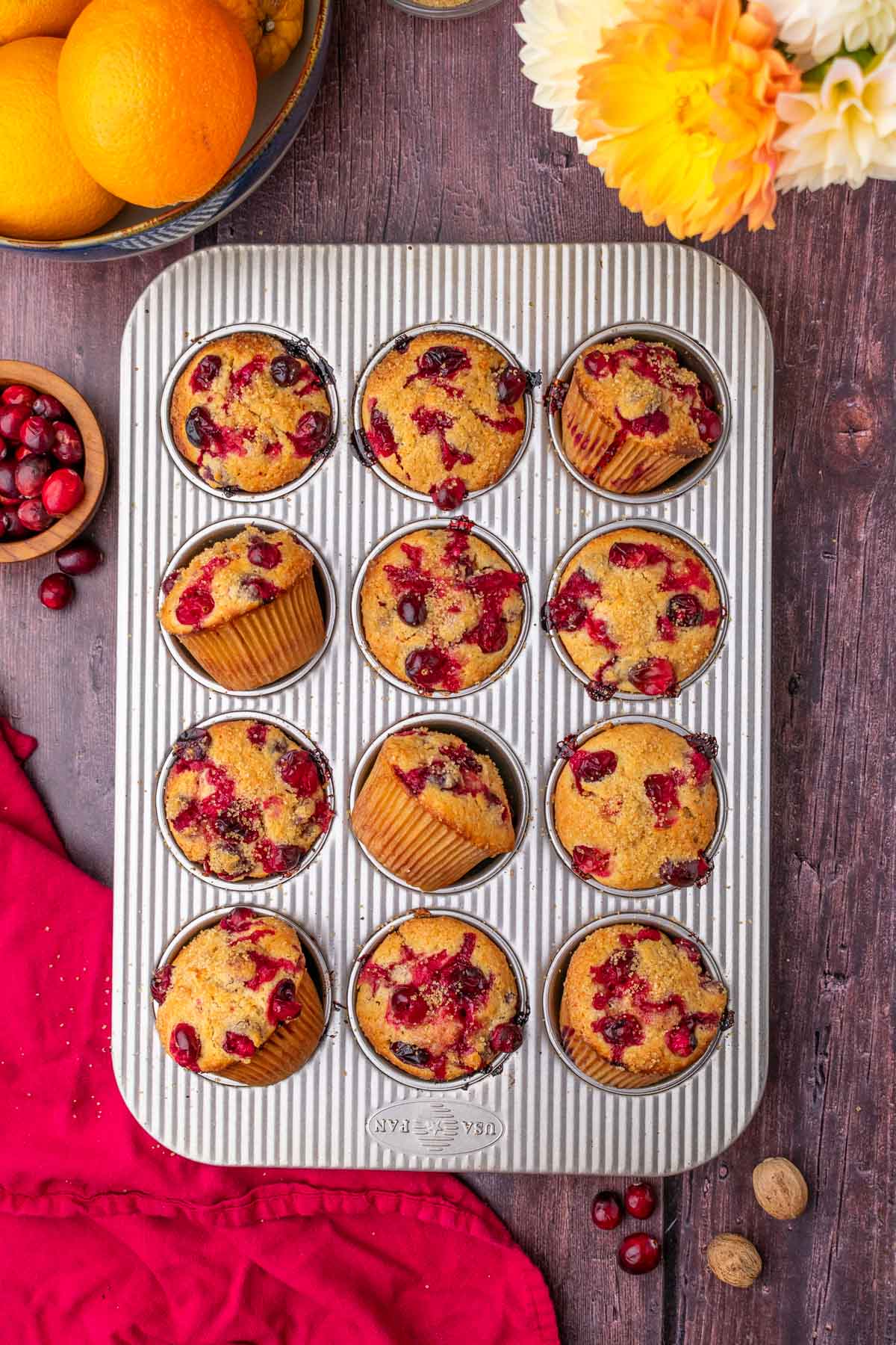 Muffin pan with baked sourdough cranberry muffins.