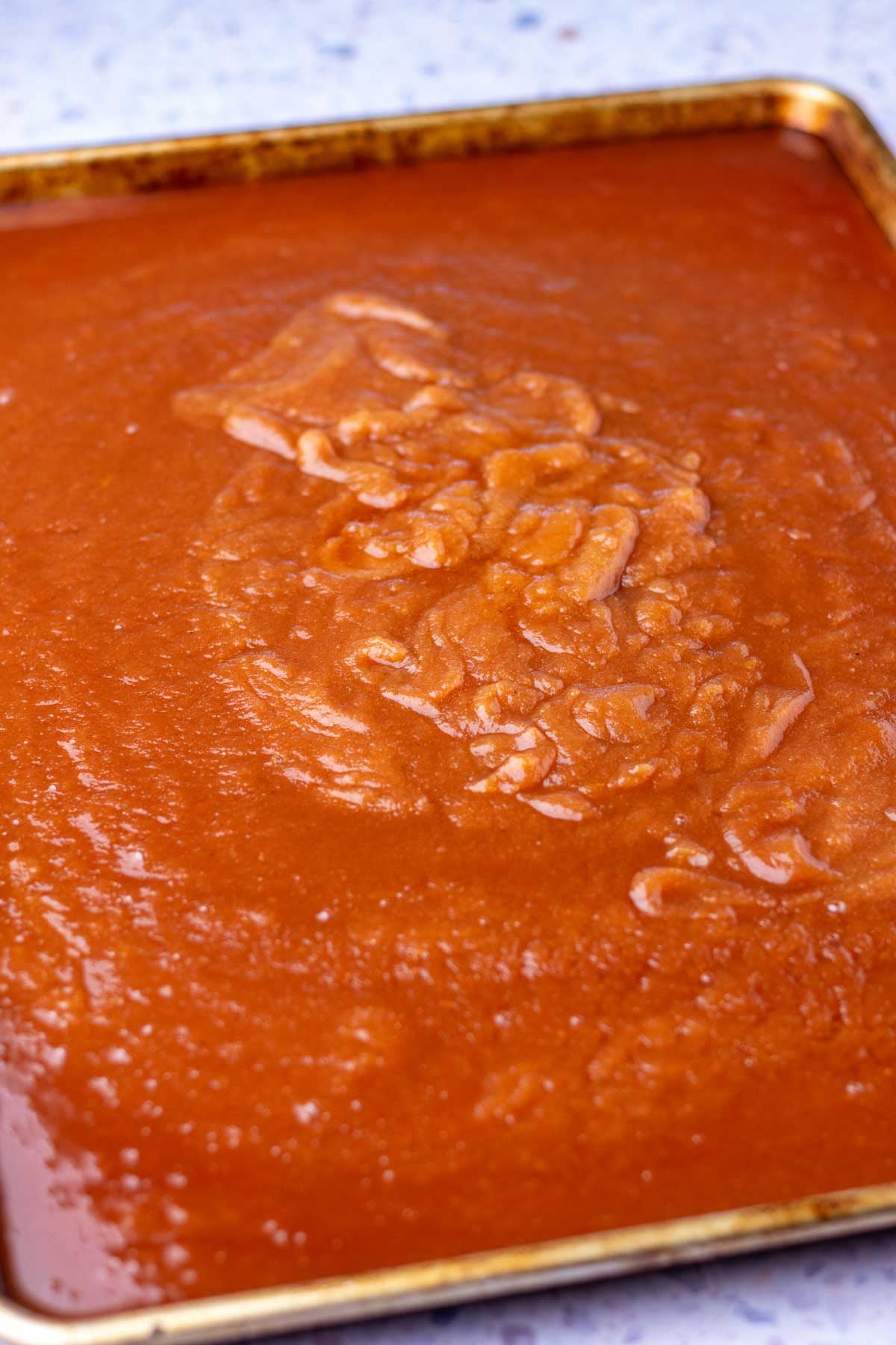 Large baking sheet with apple butter unbaked.