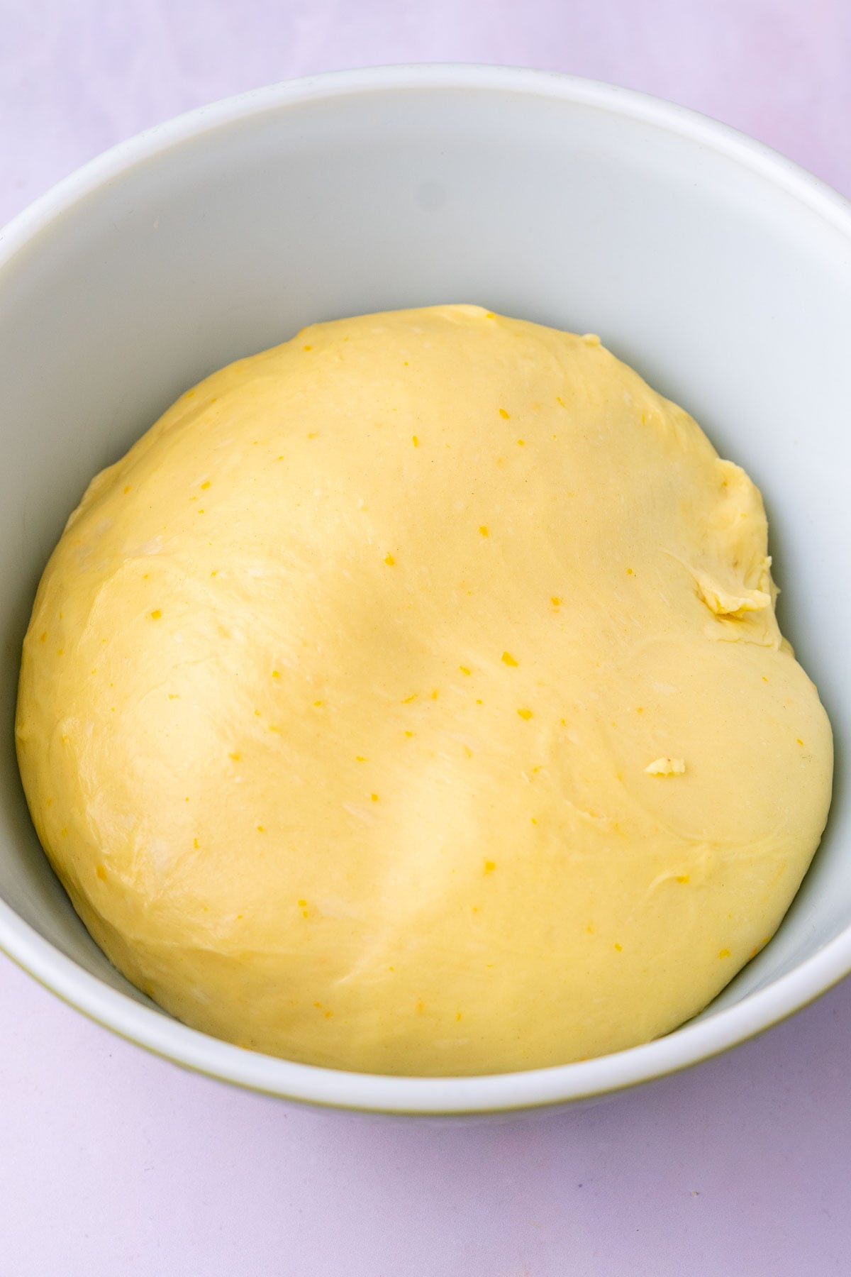 Sourdough sticky bun dough at the start of bulk fermentation in a bowl.