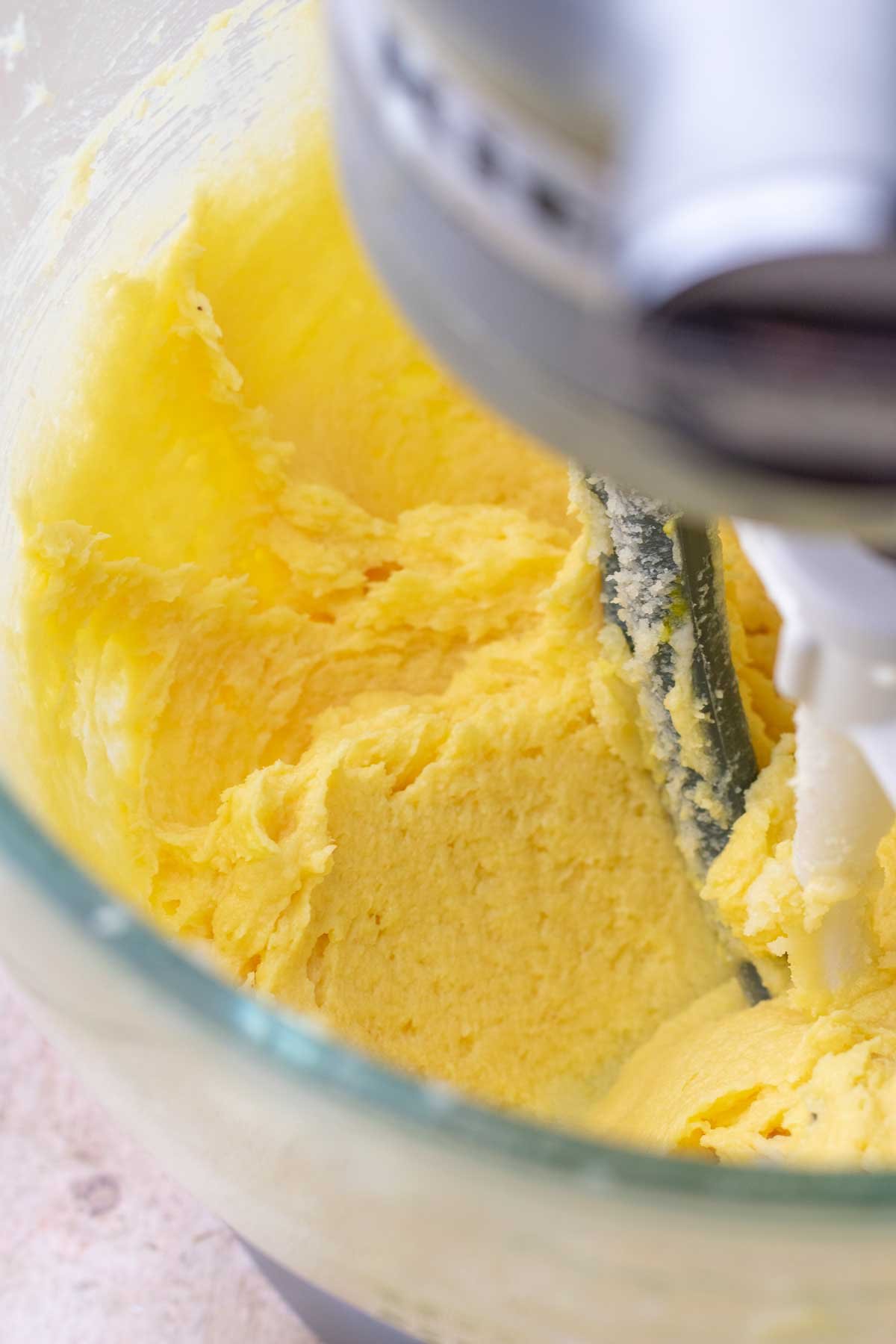 Creaming butter and sugar in a stand mixer bowl.