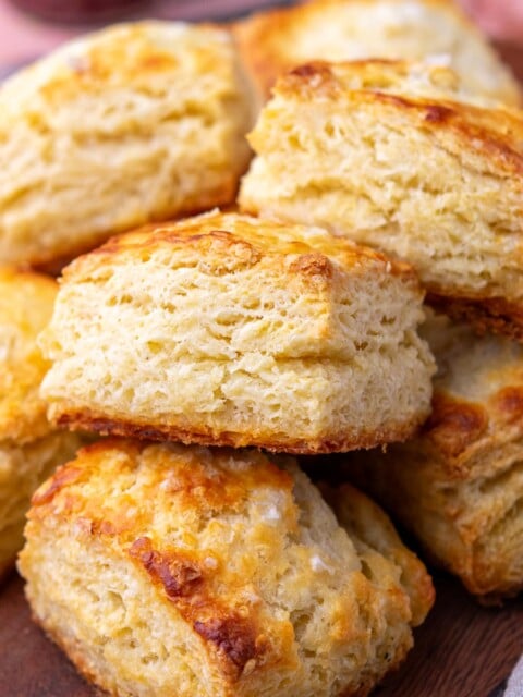 Flaky sourdough biscuits on a platter.