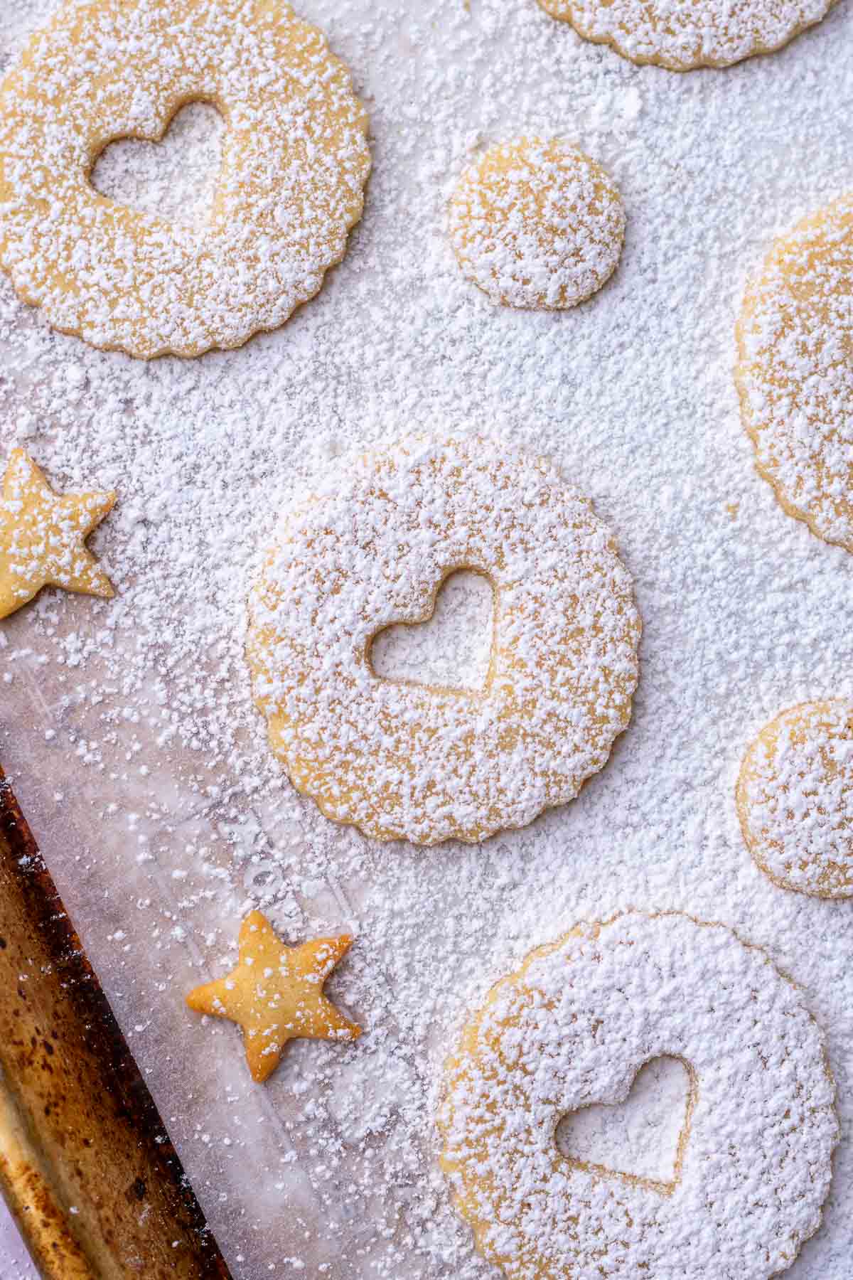 Dusted powdered sugar on sourdough linzer cookies.