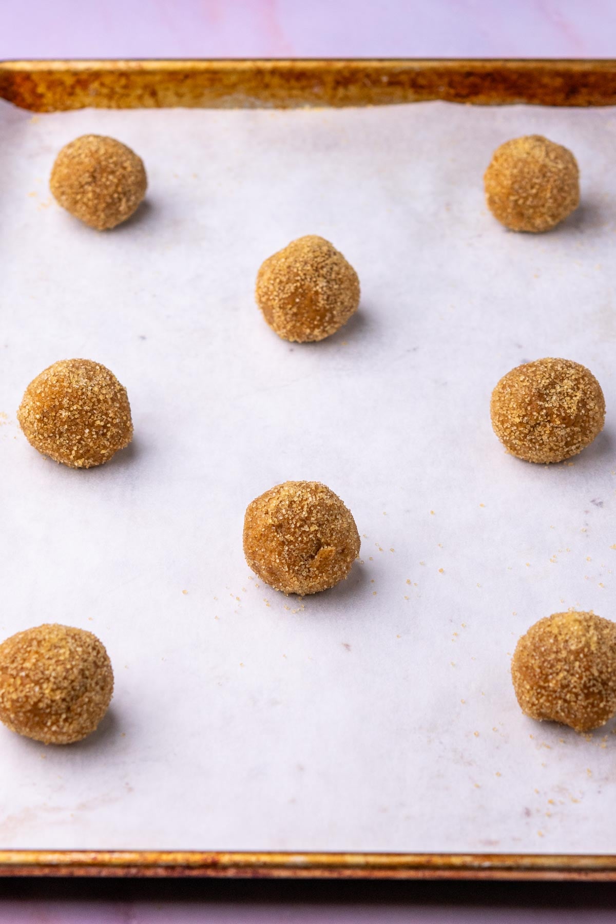 Baking sheet with unbaked Sourdough ginger molasses cookies