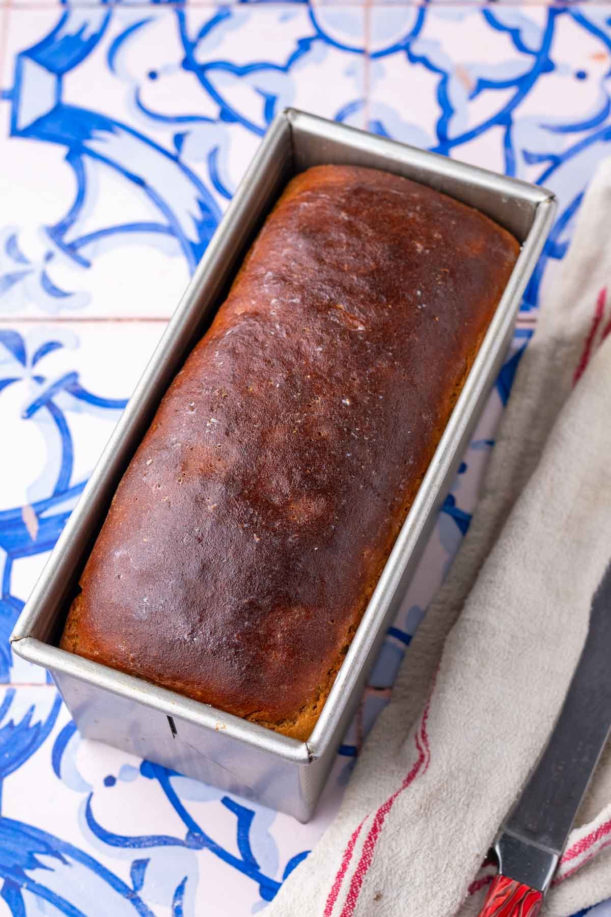 Baked einkorn sourdough sandwich bread in loaf pan.