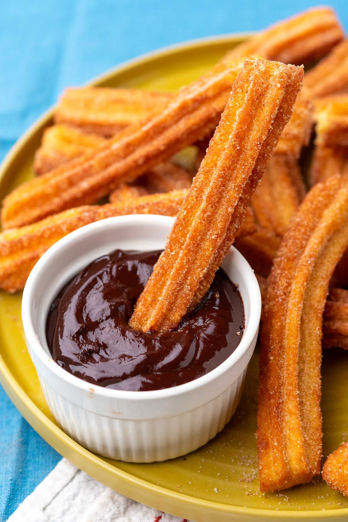 Sourdough churros dipped in chocolate sauce.