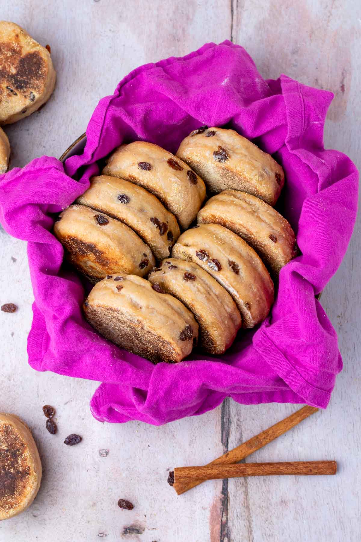 Basket of sourdough cinnamon raisin english muffins.