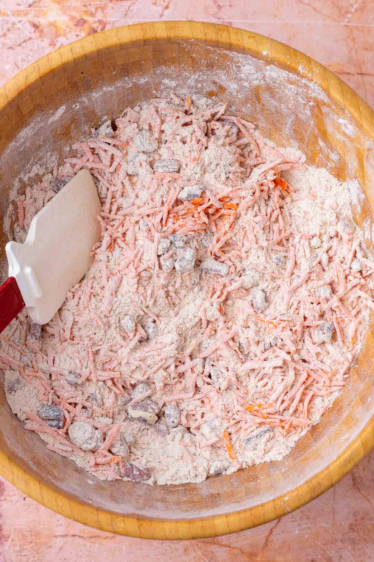 Bowl of mixed ingredients for sourdough carrot cake scones.
