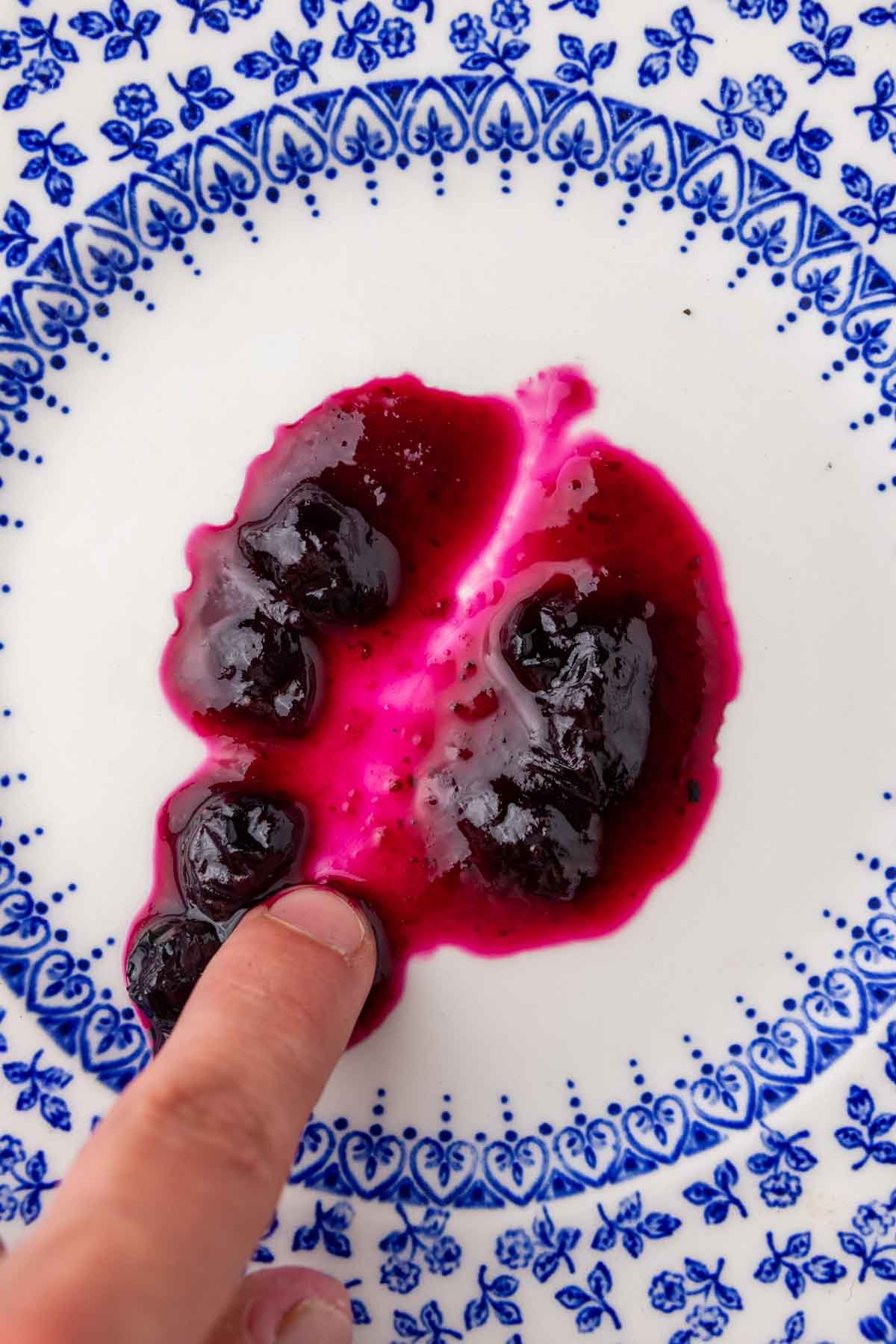 Running finger through blueberry jam and it does not pass the freezer plate test.
