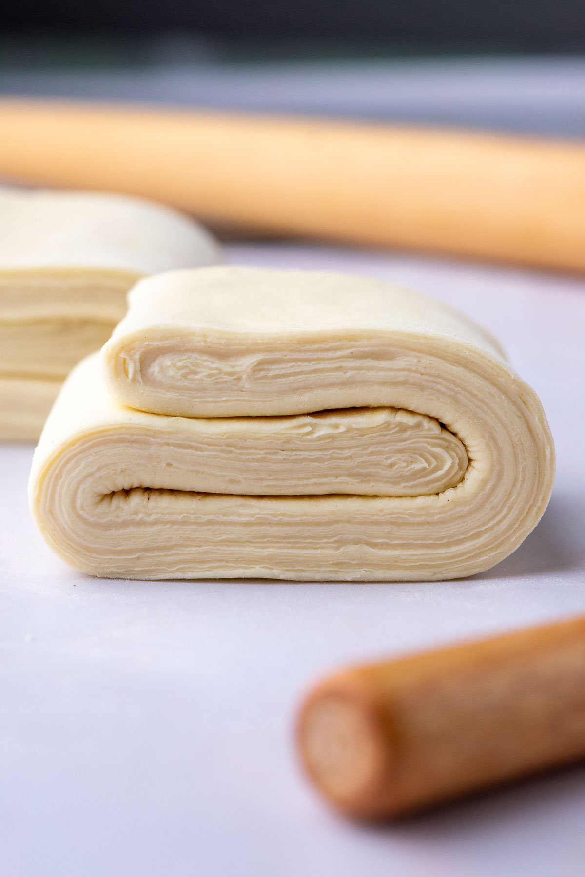 Close up detailed layers of sourdough croissant bread loaf dough.