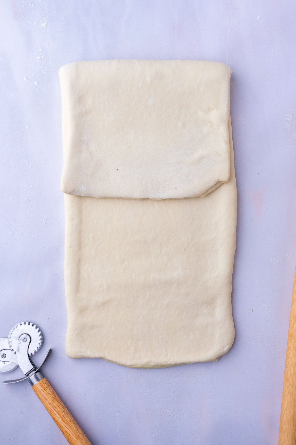 First fold of sourdough croissant bread loaf dough.