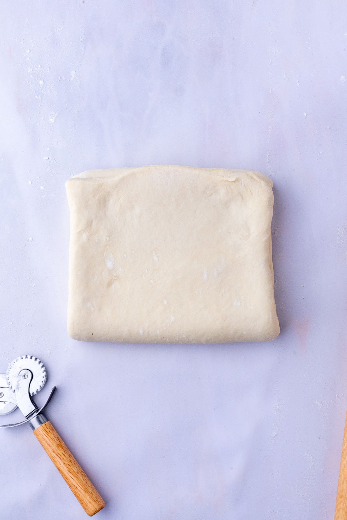 Letter fold of sourdough croissant bread loaf dough.