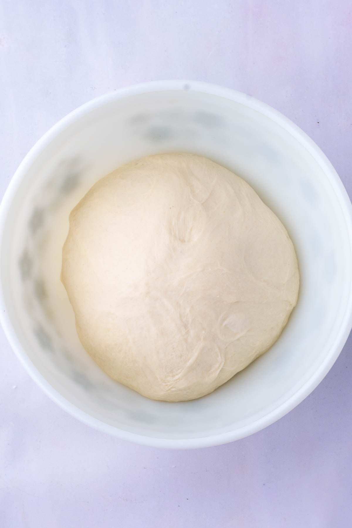 Sourdough croissant bread loaf dough at the start of bulk fermentation.