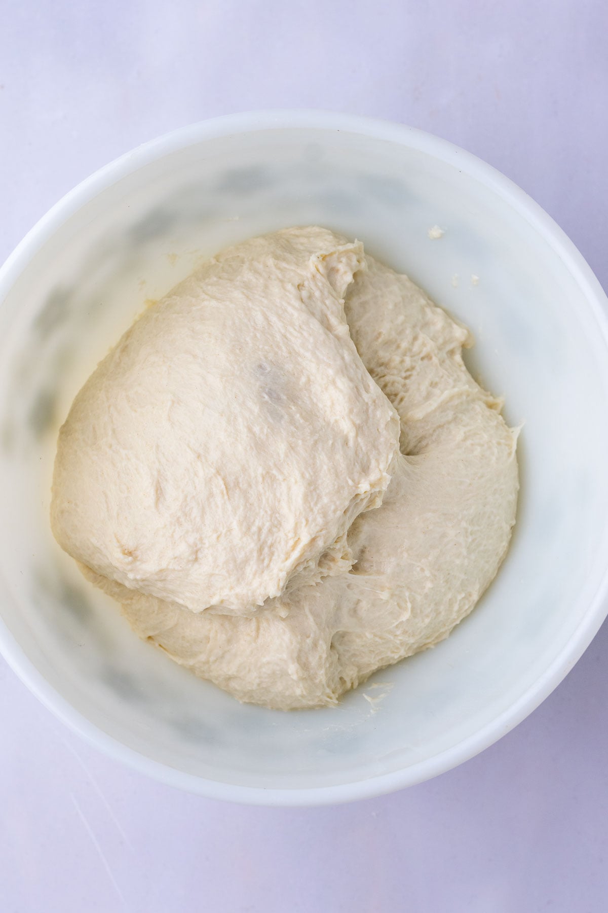 Sourdough pita bread dough in bowl at the start of bulk fermentation.