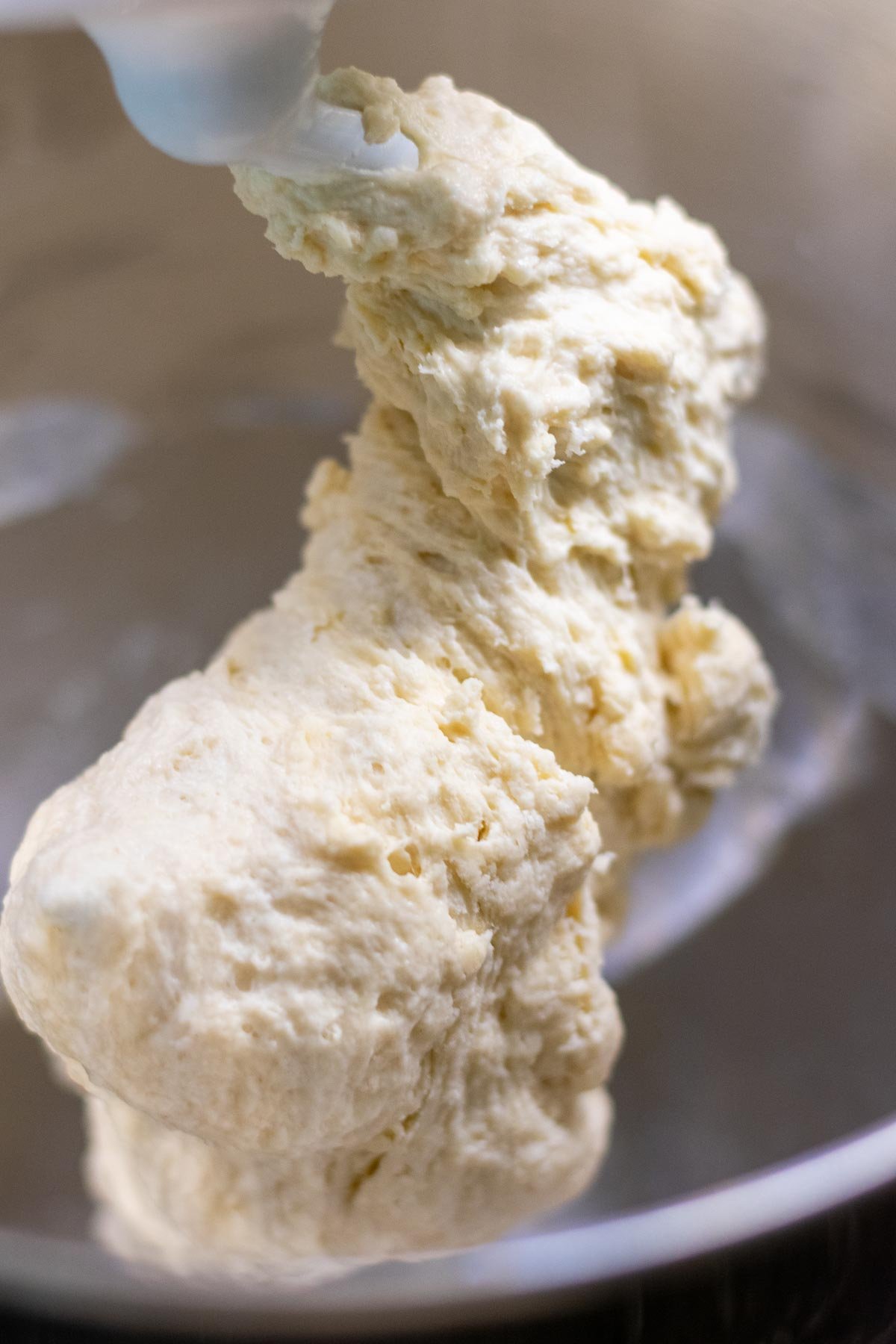 Start of mixing sourdough pita bread dough in a stand mixer with the dough hook.