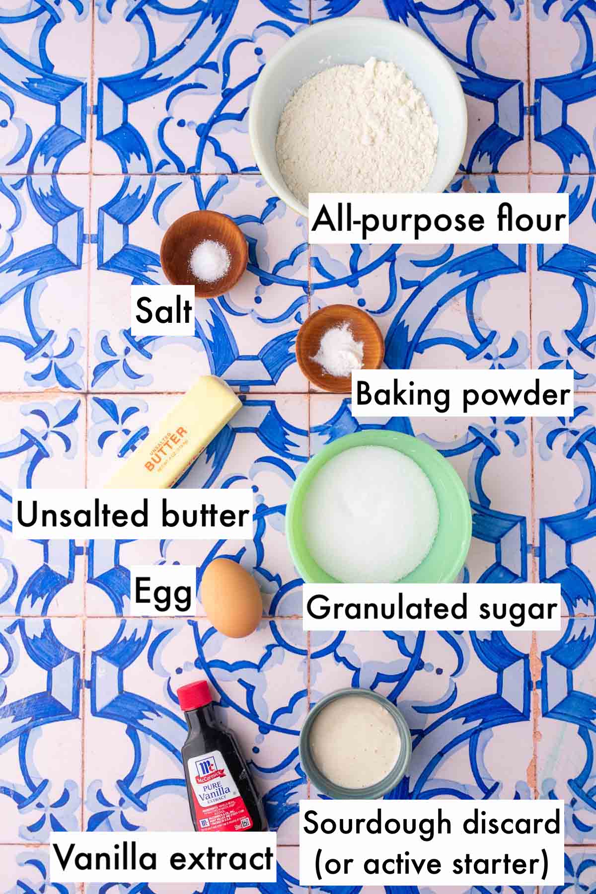 Labeled bowls of ingredients needed for sourdough vanilla wafers including all-purpose flour, salt, baking powder, unsalted butter, granulated sugar, egg, vanilla extract, and sourdough discard.