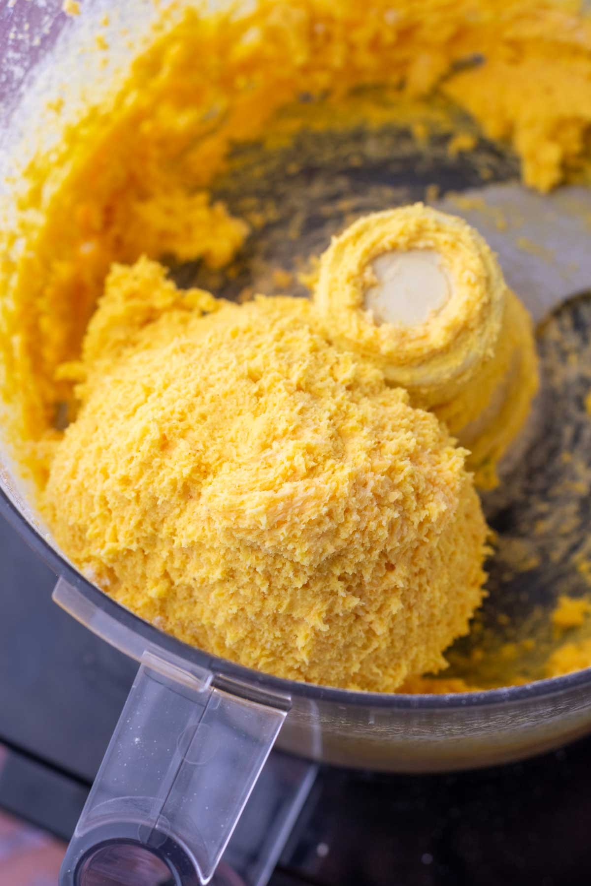 Sourdough discard cheese cracker dough mixed in a food processor.