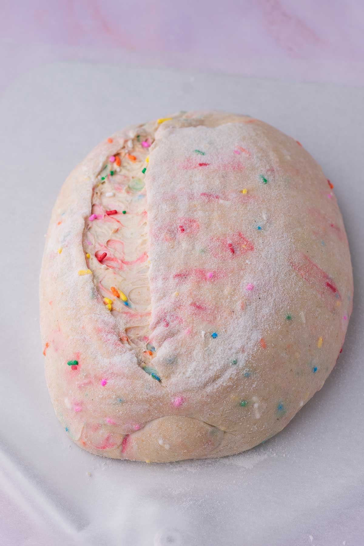 Scored funfetti sourdough bread before baking.