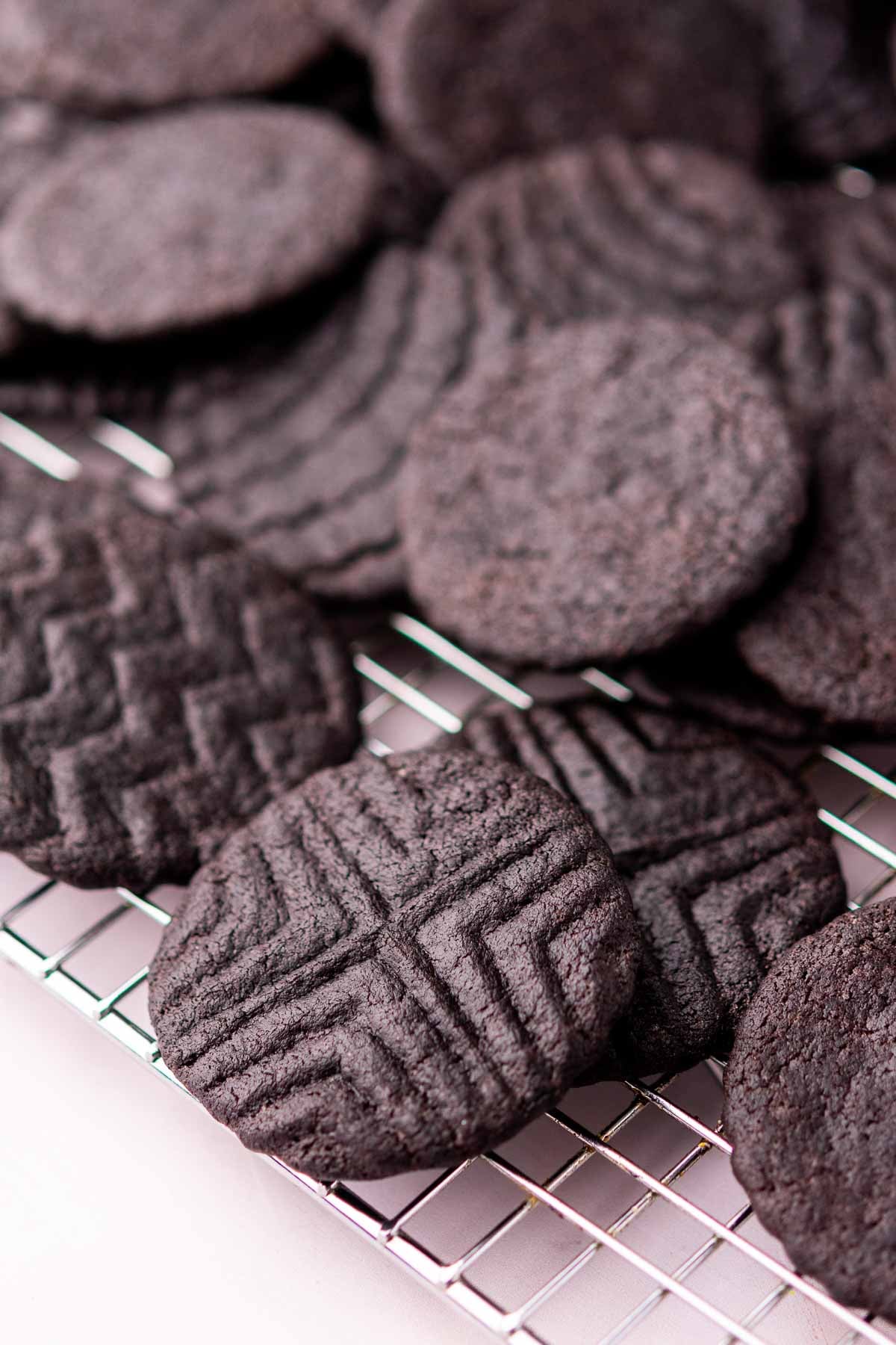 Baked sourdough oreo cookies with designs.