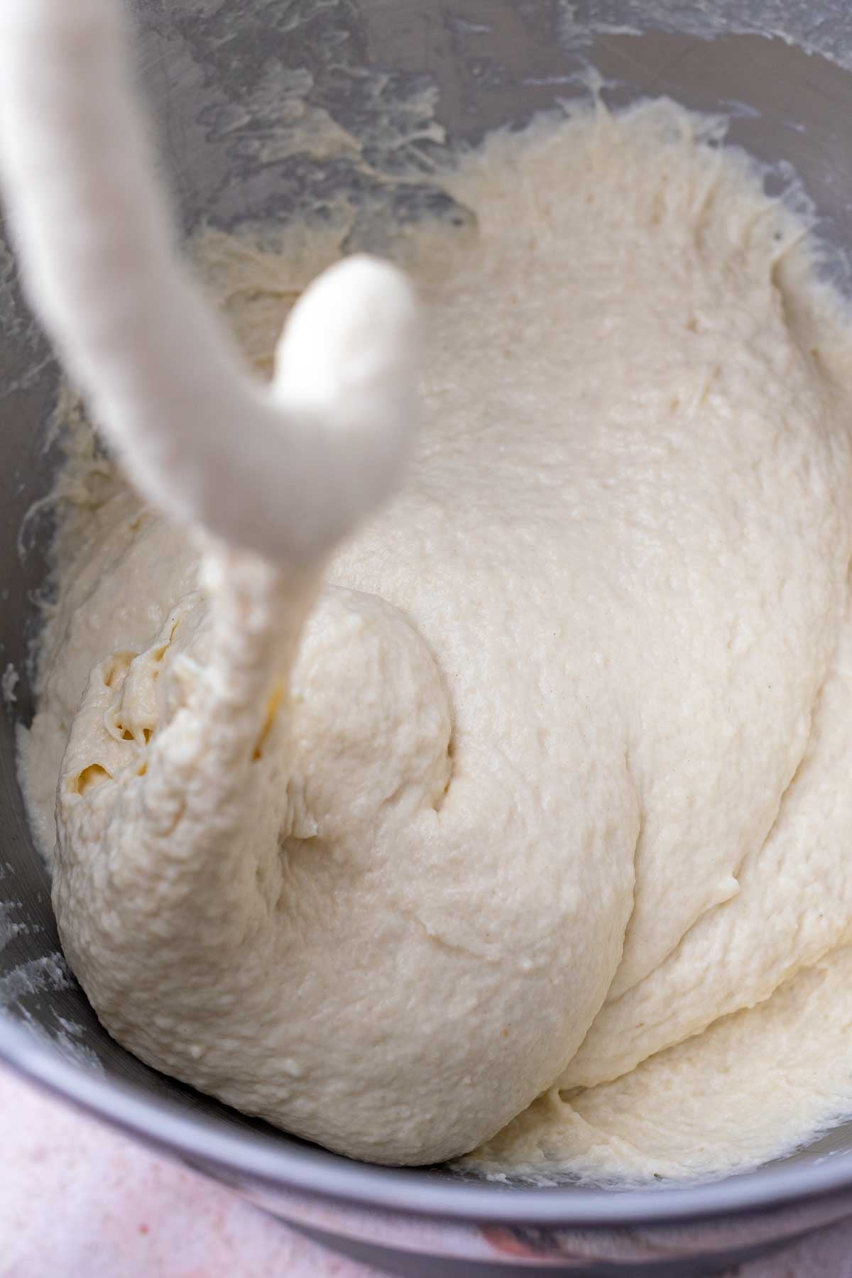 Start of mixing sourdough pizza al taglio dough with a dough hook.