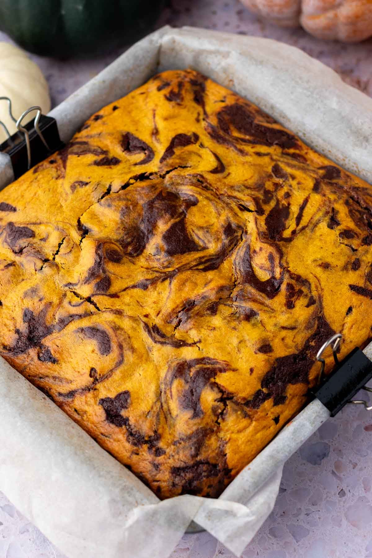 Baked sourdough pumpkin brownies in baking pan.