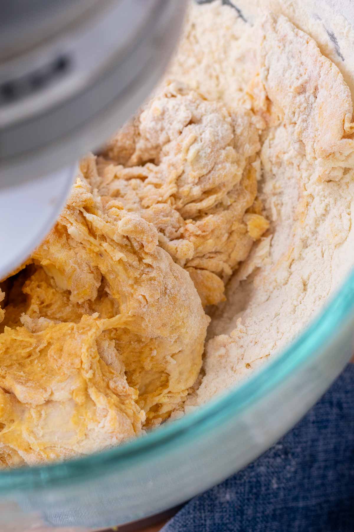 Mixing sourdough pumpkin cinnamon swirl bread in a stand mixer bowl.