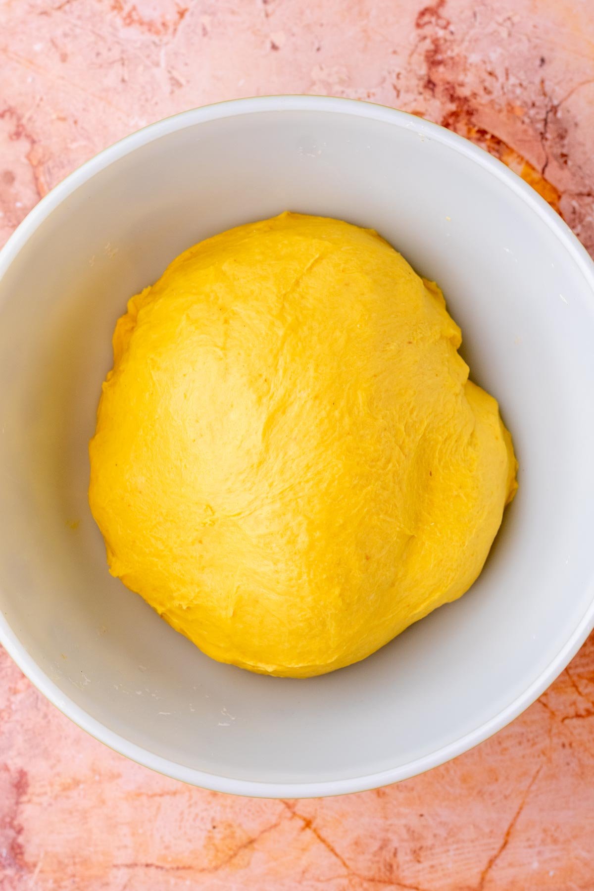 sourdough pumpkin cinnamon swirl bread dough in bowl at the start of bulk fermentation.