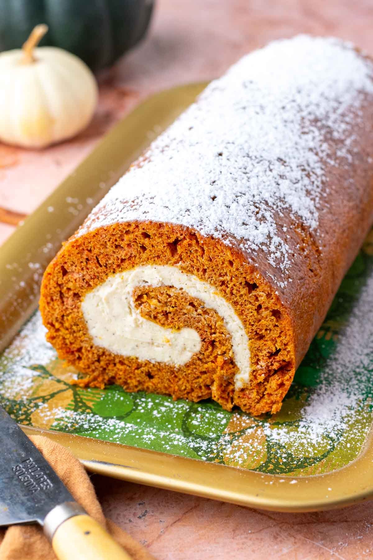 Sliced sourdough pumpkin roll on a platter.