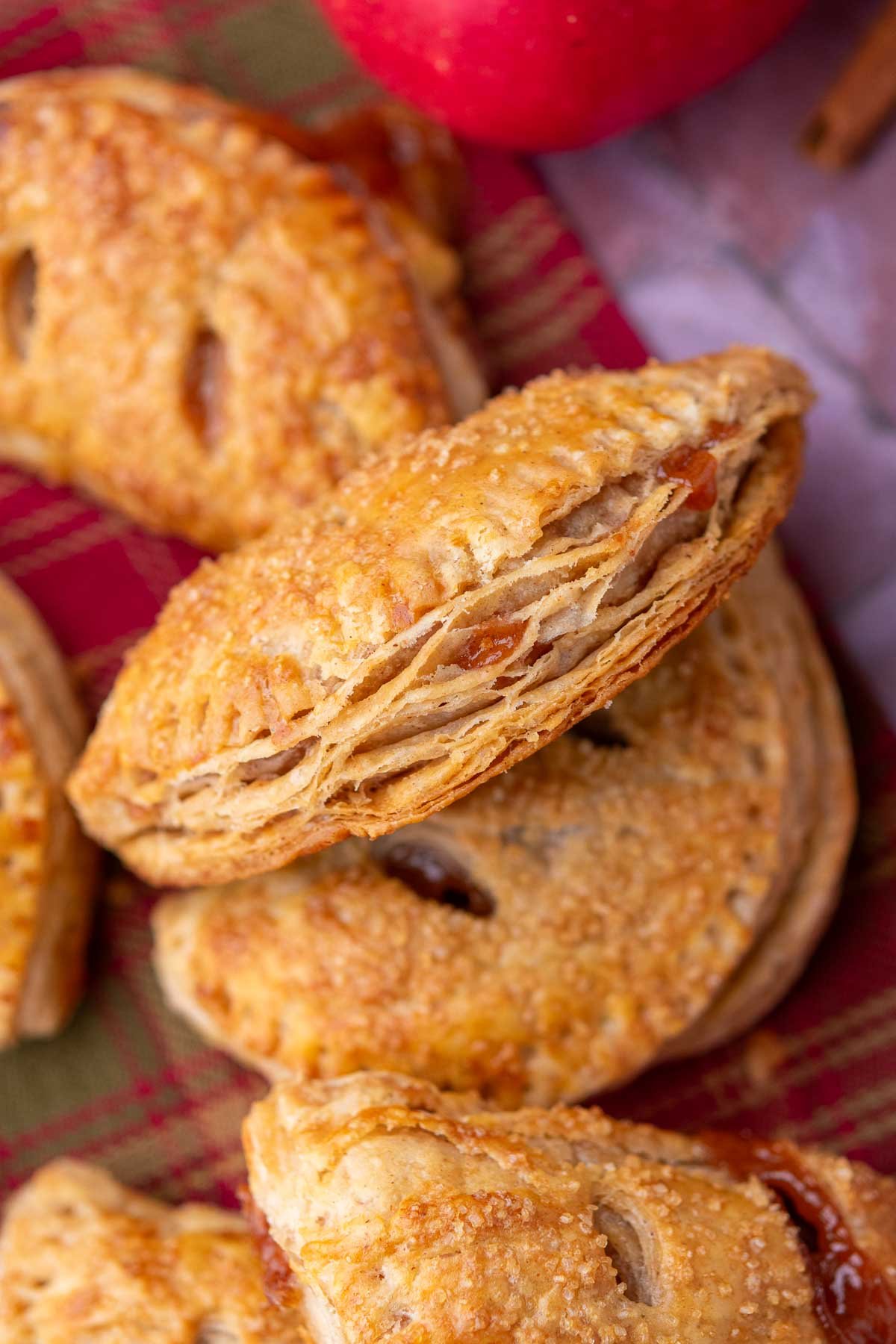 Up close image of flaky sourdough apple hand pies.