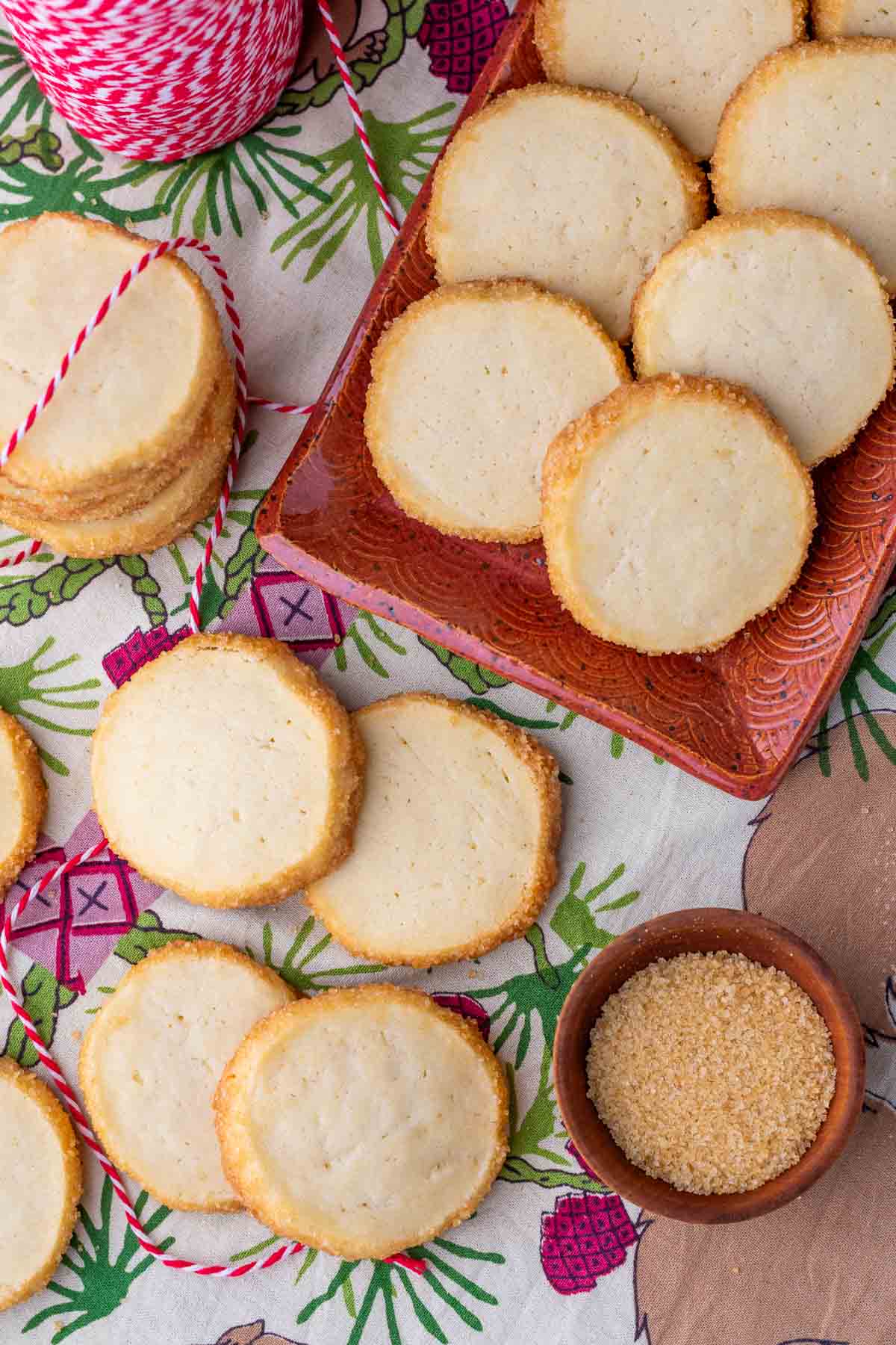 Sourdough shortbread cookies on a Christmas spread and platter with red and white twine.