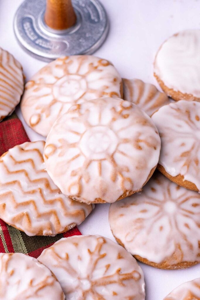 Soft glazed sourdough gingerbread cookies with snowflake and geometric patterns.