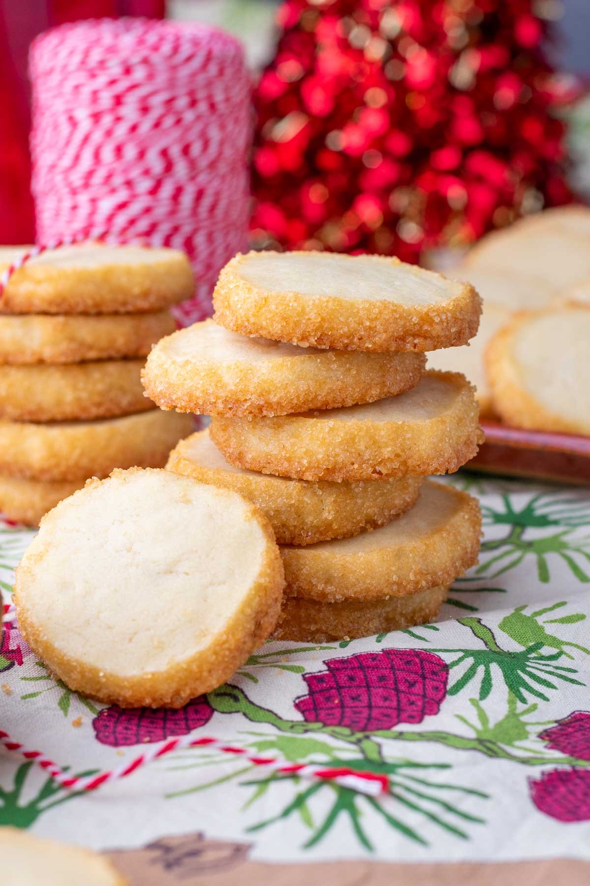 Stack of sourdough shortbread cookies with Christmas decorations.