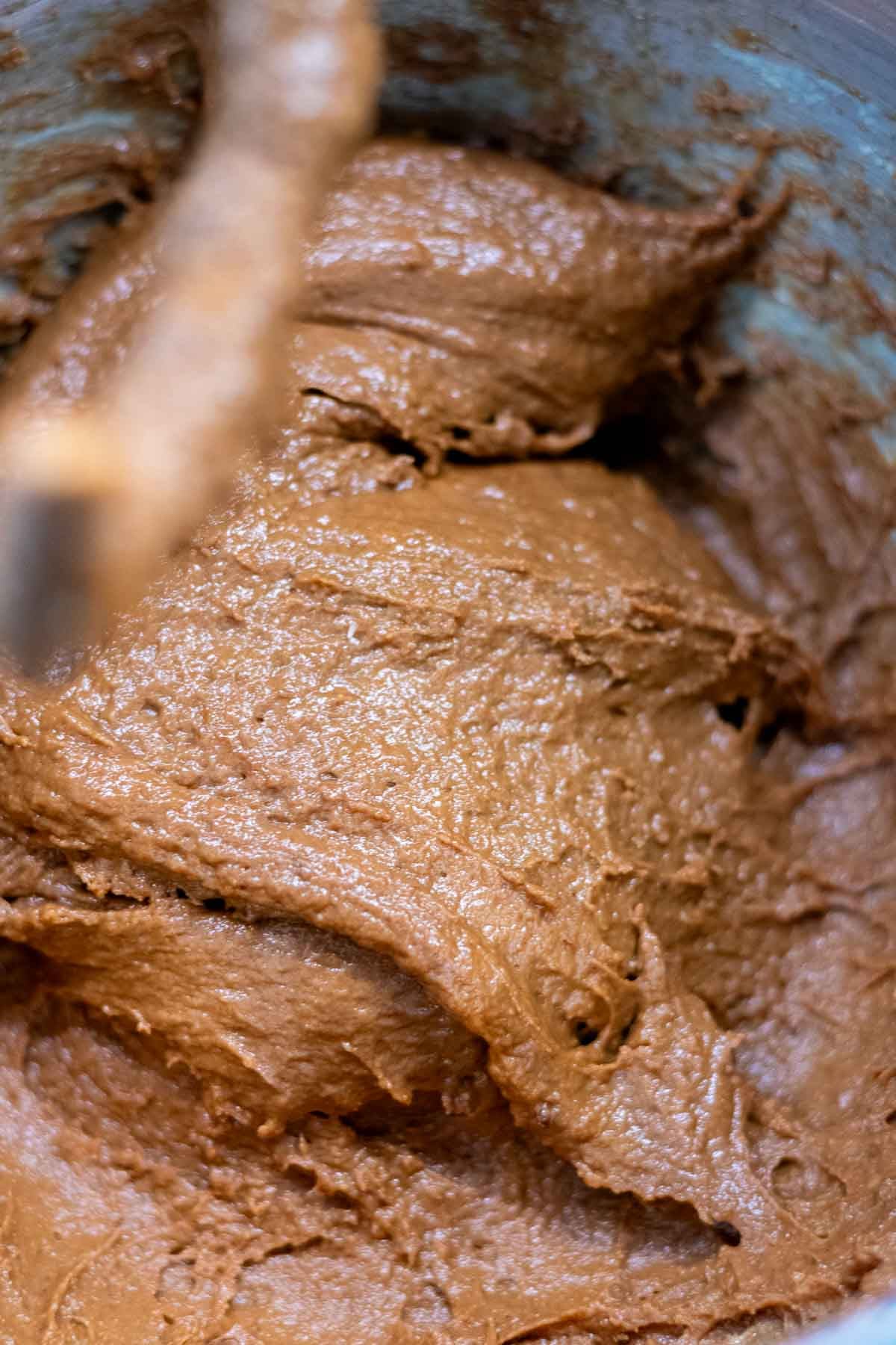 Sourdough chocolate brioche dough in a stand mixer bowl at the start of mixing.