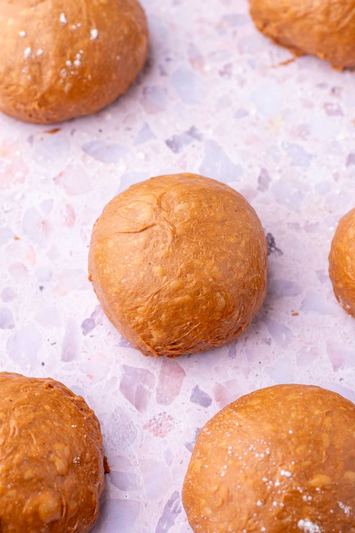 Shaped sourdough chocolate brioche dough into balls.