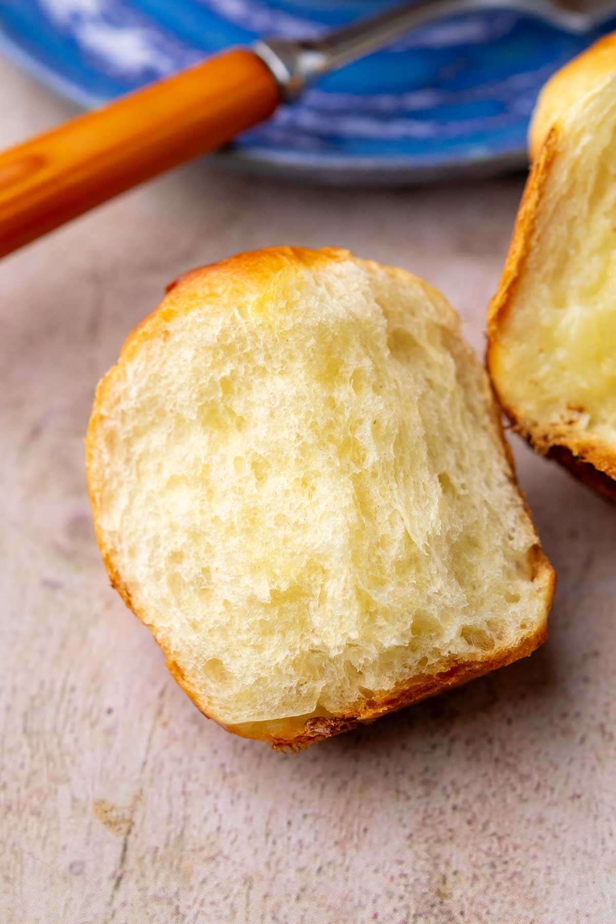 Fluffy interior of a cloverleaf sourdough dinner roll.