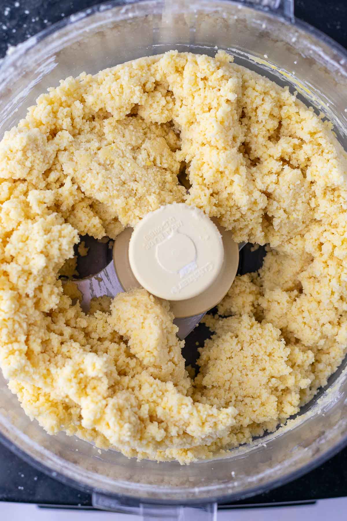 Mixed Sourdough Butter Cracker dough in a food processor.