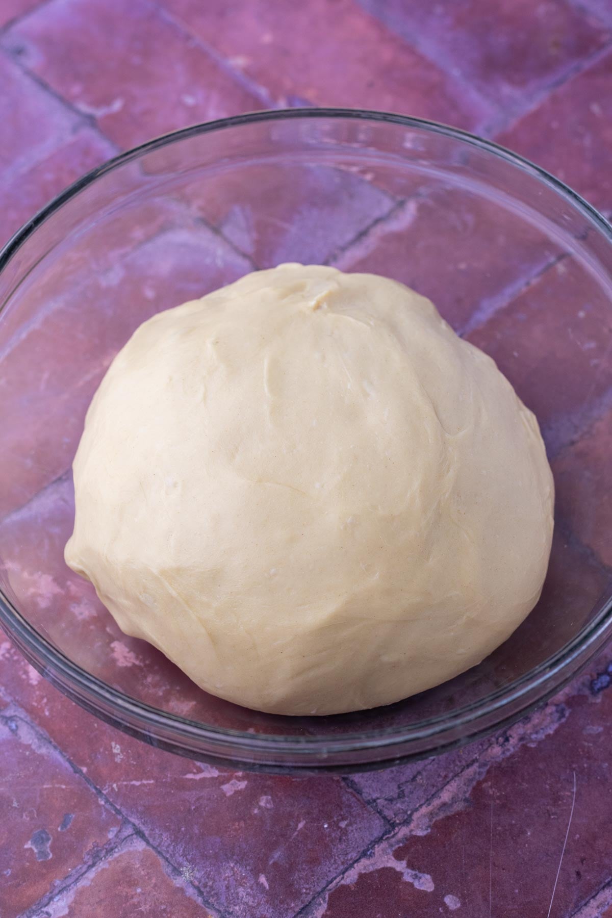 Start of bulk fermentation for sourdough brioche dough in a glass bowl.