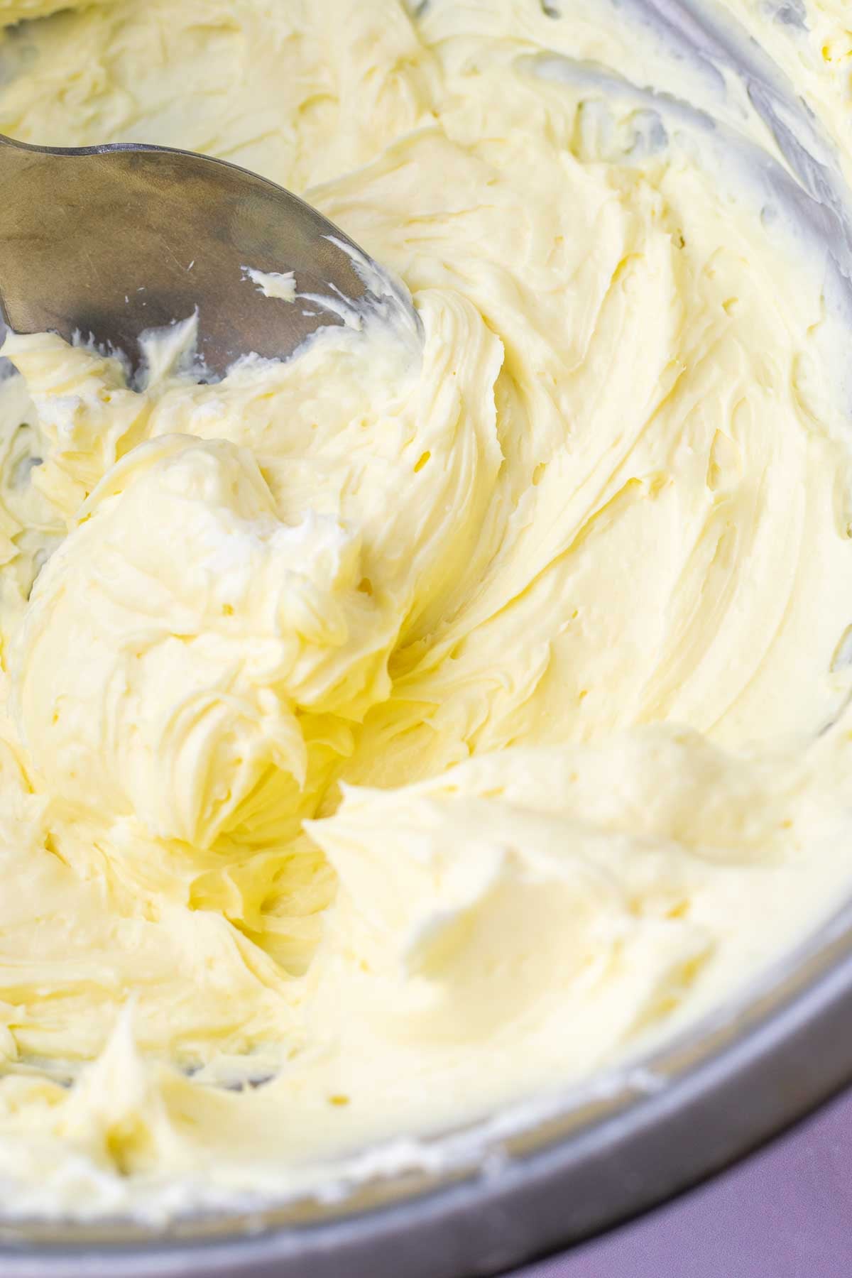 Bowl with cream cheese filling and a spoon.