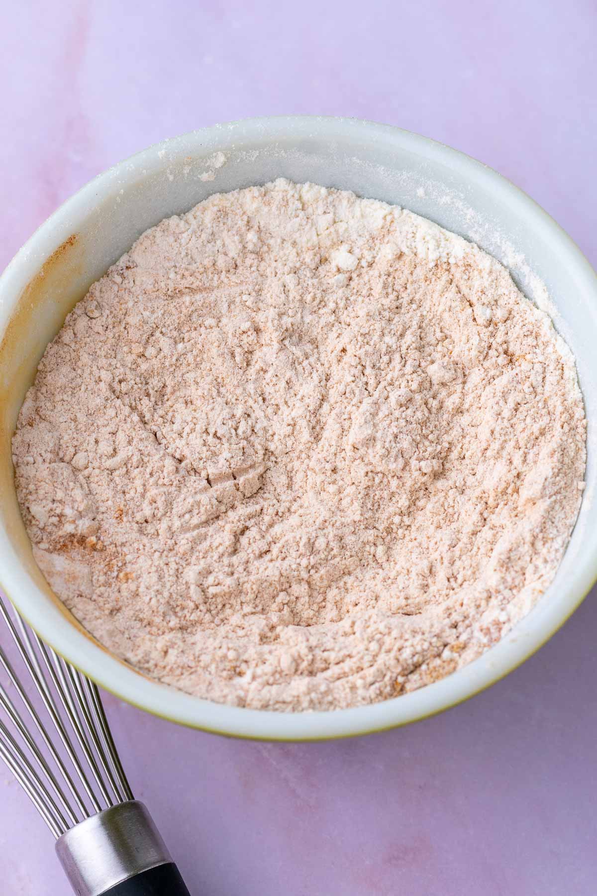 Bowl of dry ingredients for sourdough carrot cake muffins.