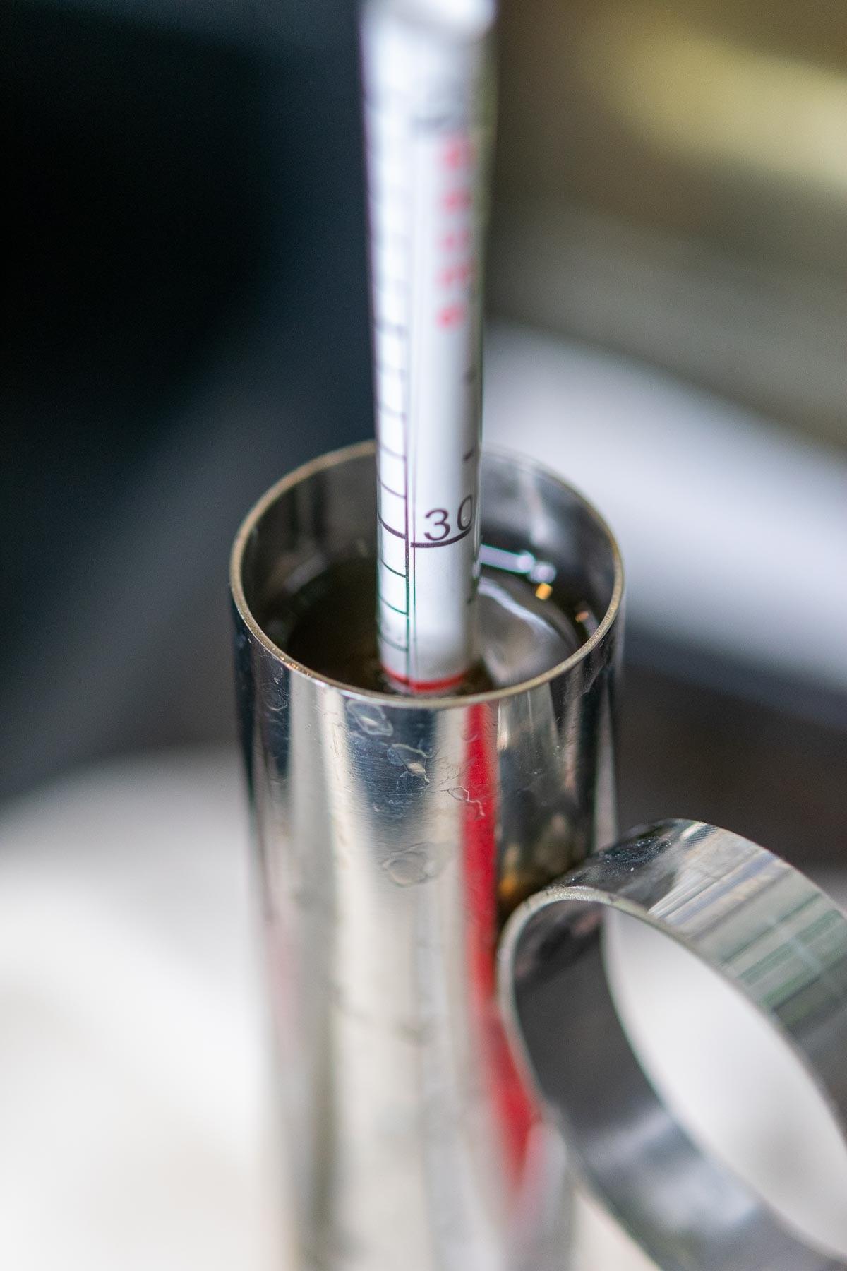 A hydrometer testing maple syrup.