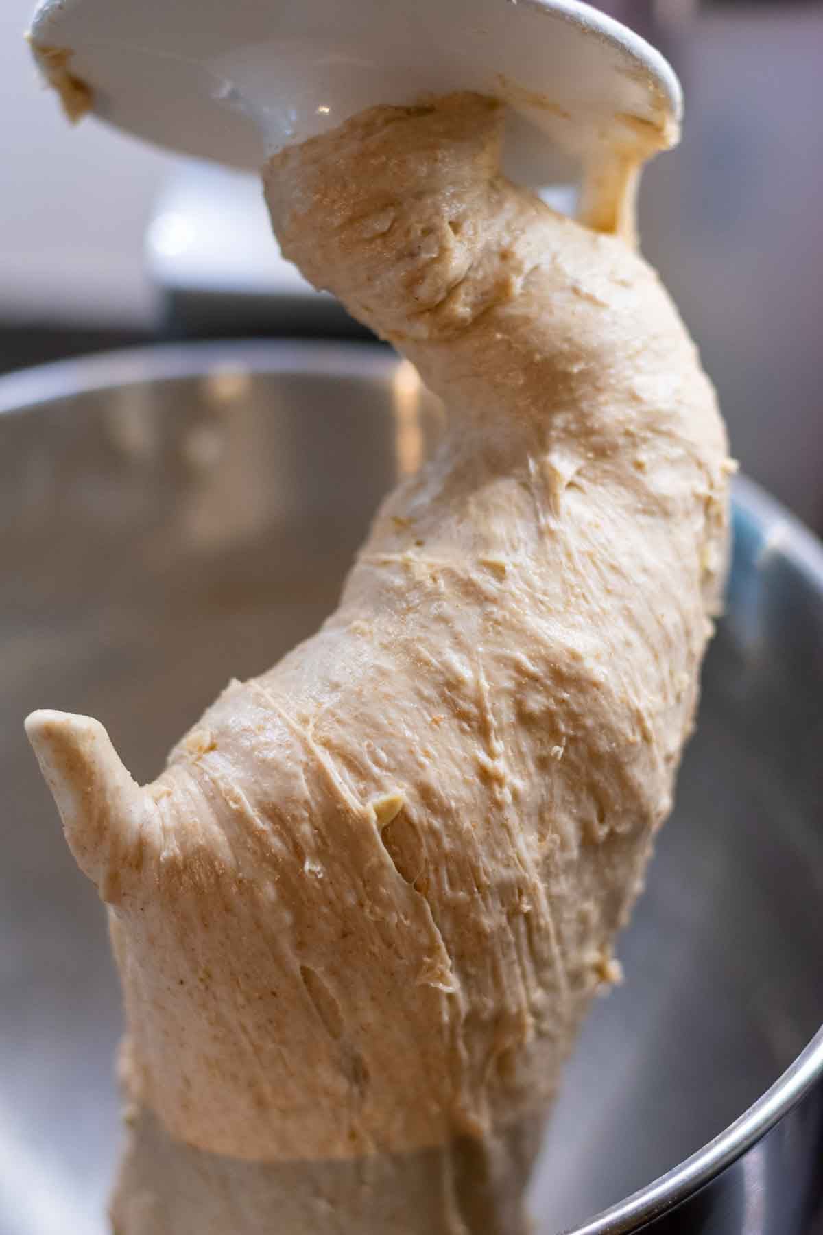 Mixed maple oat sourdough sandwich bread on a dough hook.