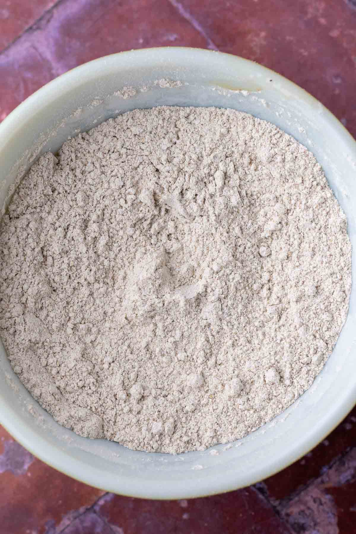 Bowl of dry ingredients for sourdough rye chocolate chip cookie.