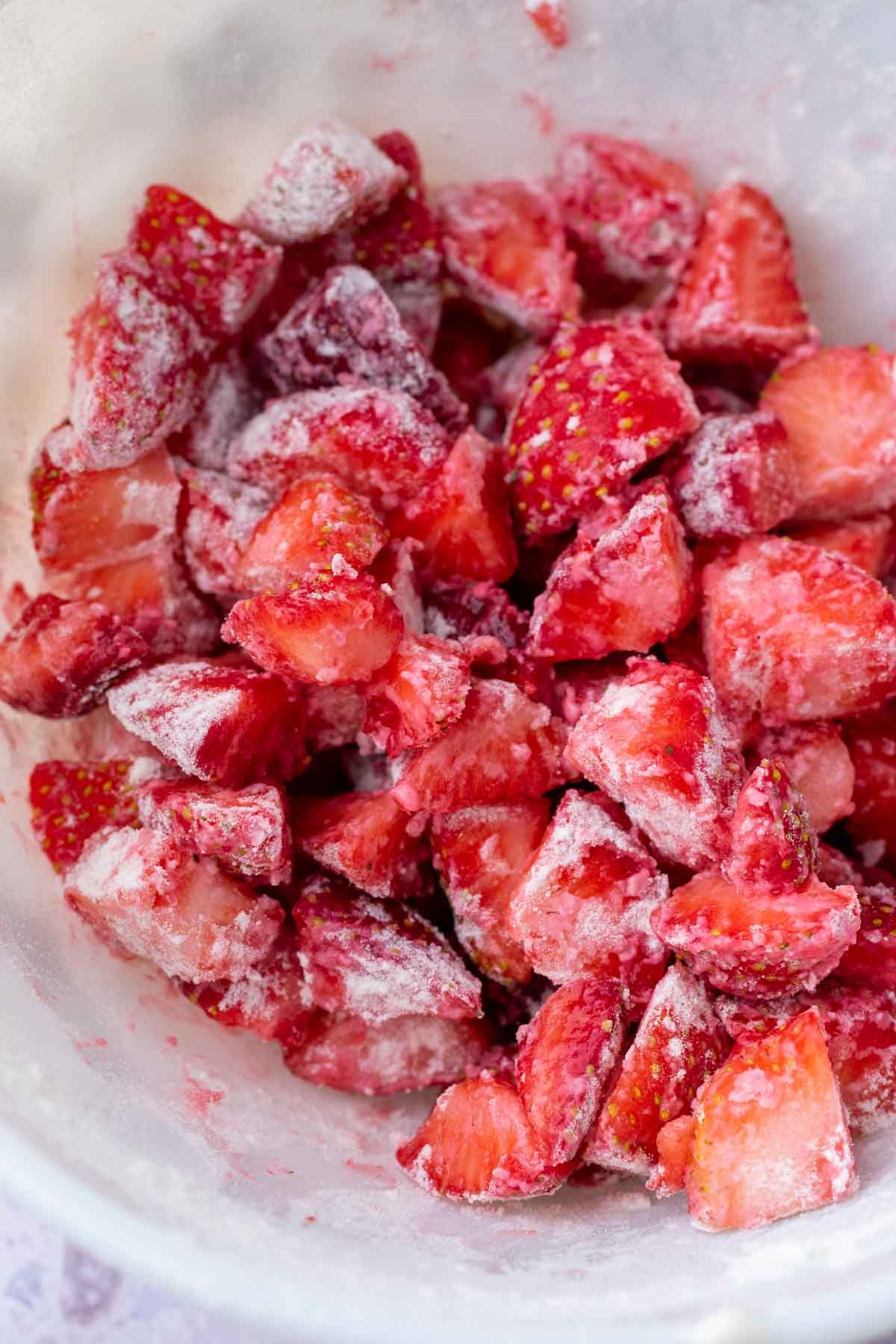 Chopped fresh strawberries coated in flour.