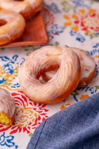 sourdough crullers on a colorful tablecloth.