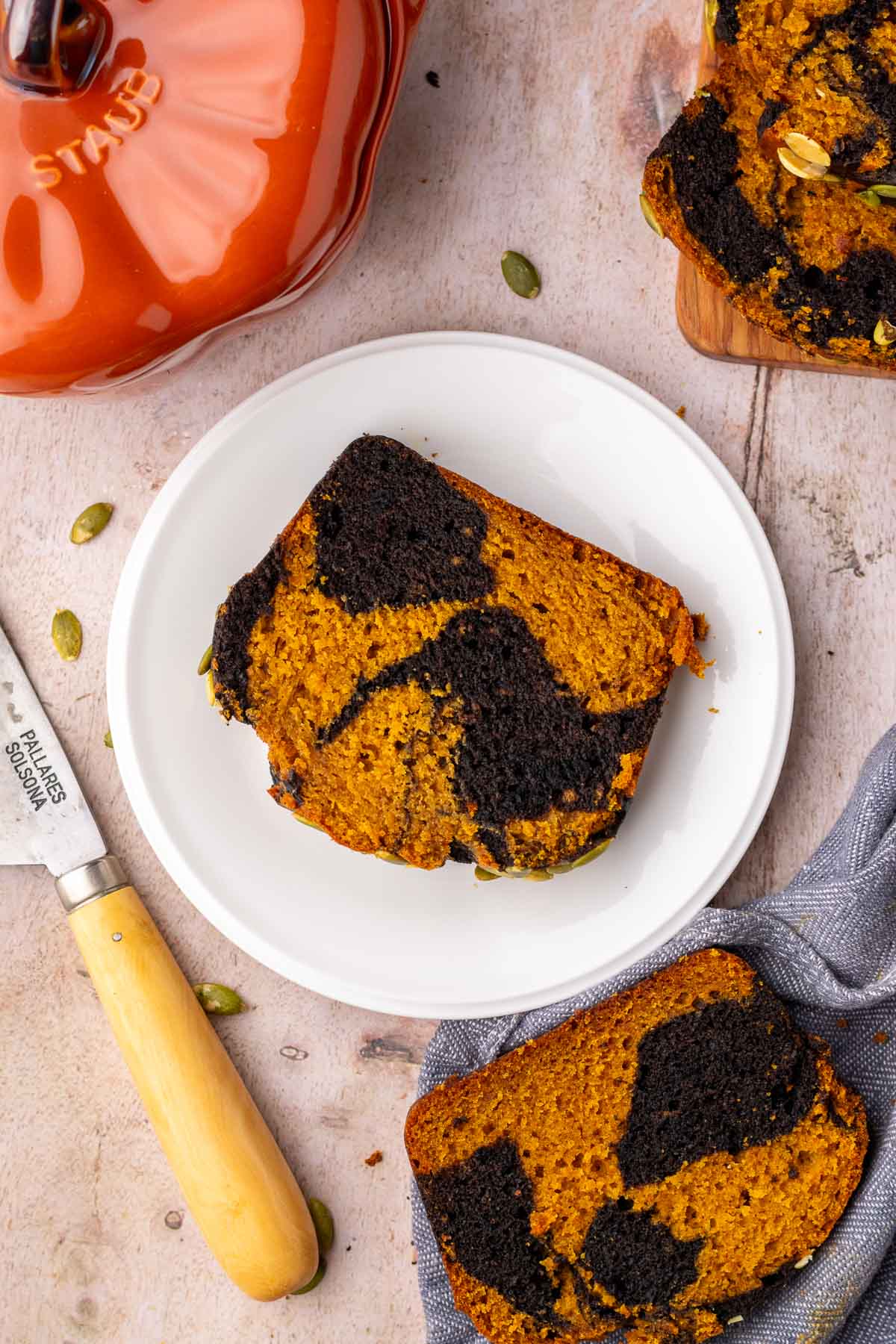 Slice of sourdough pumpkin marble bread on a plate.