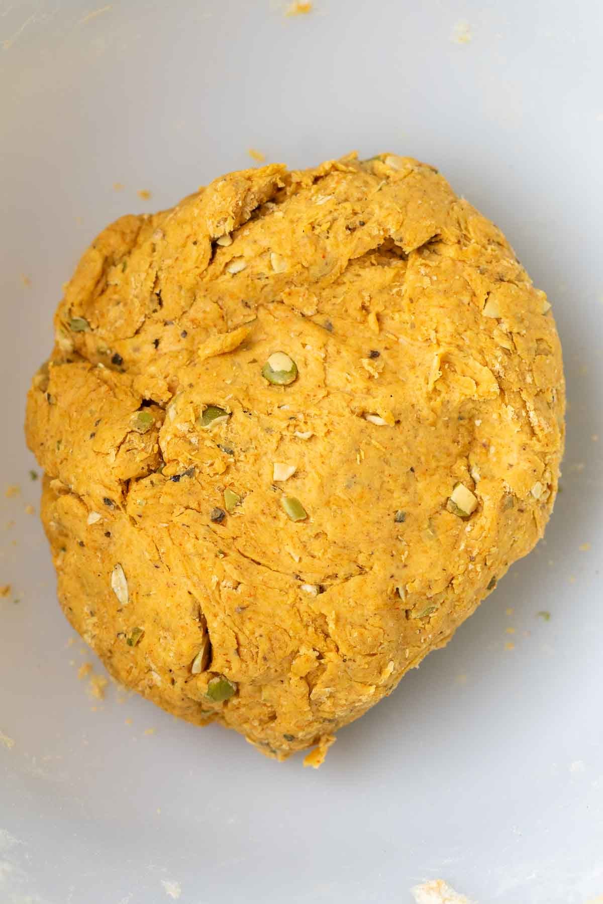 Sourdough pumpkin cracker dough in a bowl.